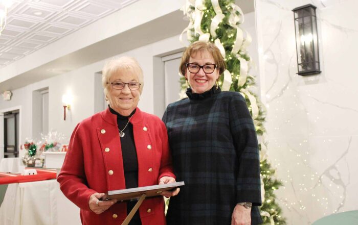 Employee Frances Gula receives length of service certificate