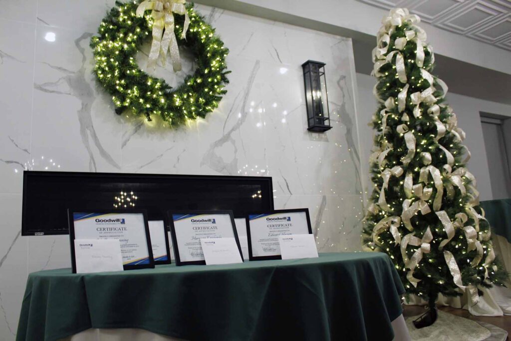 Certificates on display with a holiday background