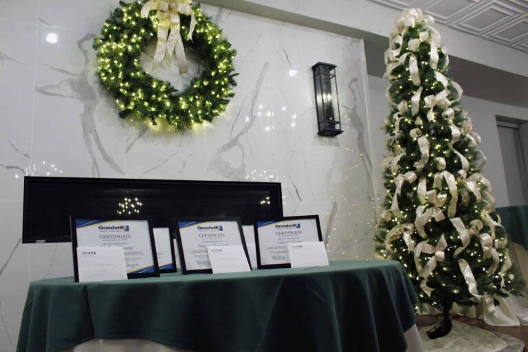 Certificates on display with a holiday background