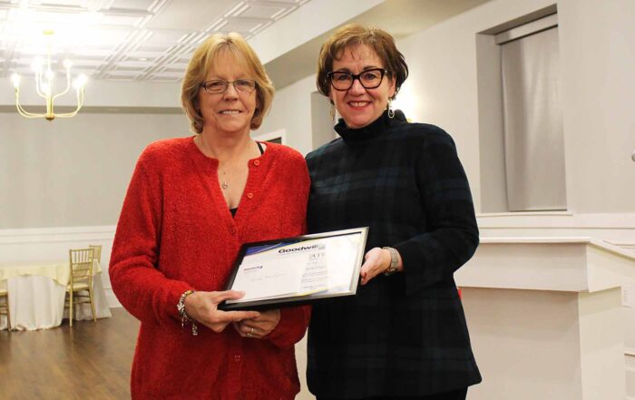 Employee Teresa Marchakitus receives length of service certificate